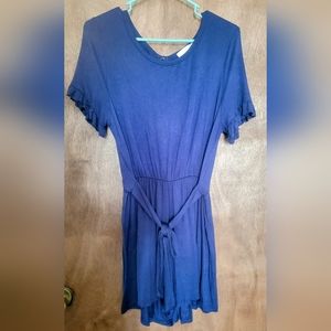 French Grey navy blue jersey tie waist romper with Ruffle sleeve accents. Size L